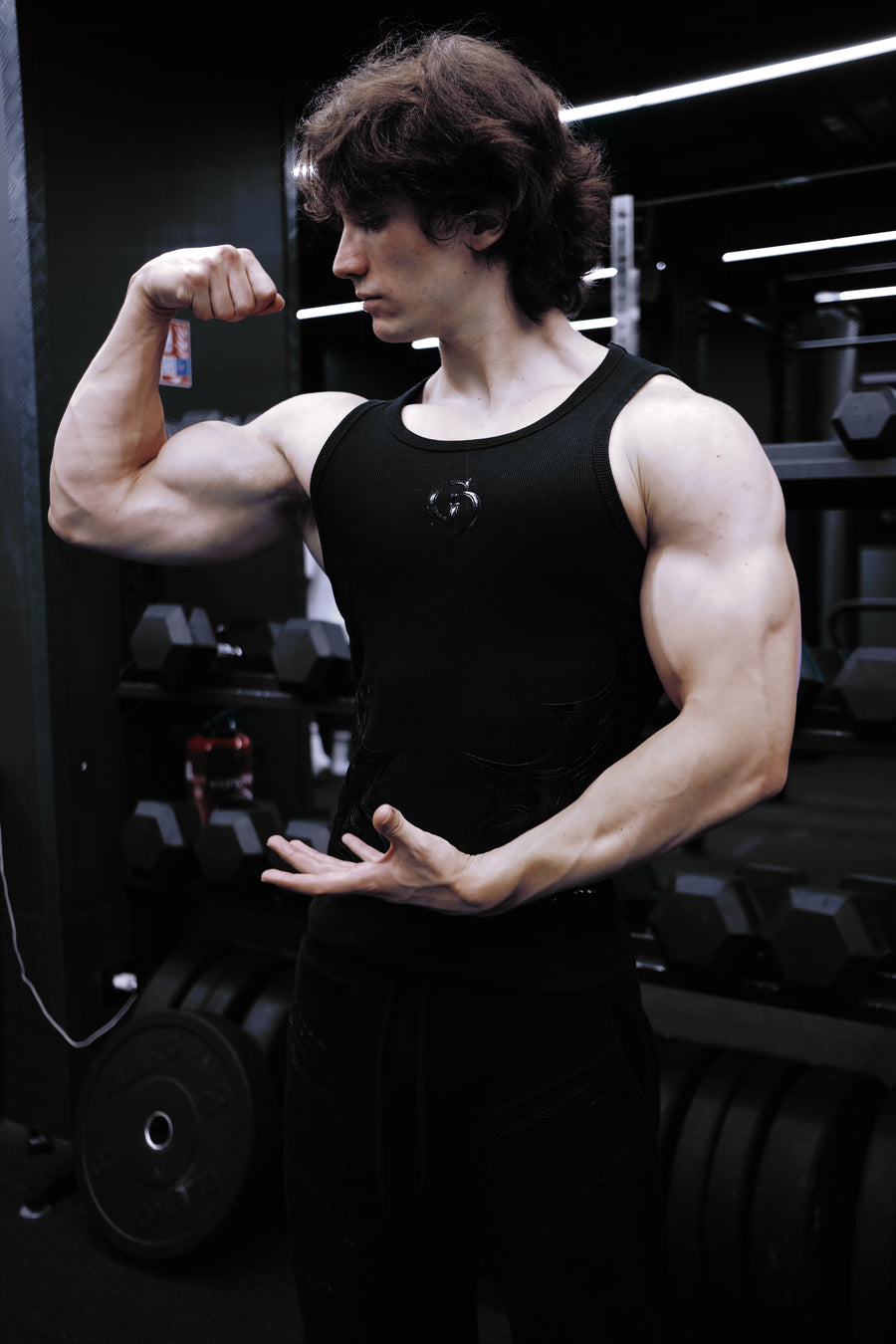 Fallen Tank Midnight worn in the gym, arm flex