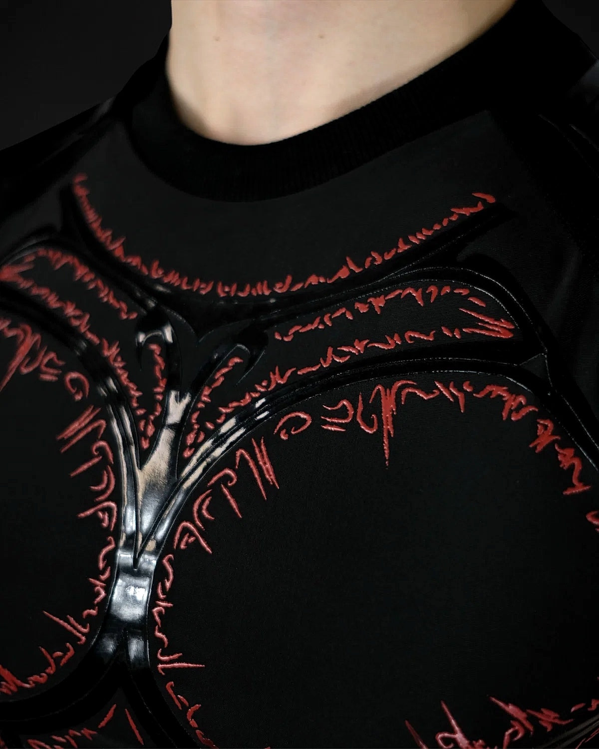 Knight Compression Blood, close-up of the red runes at the collar and chest