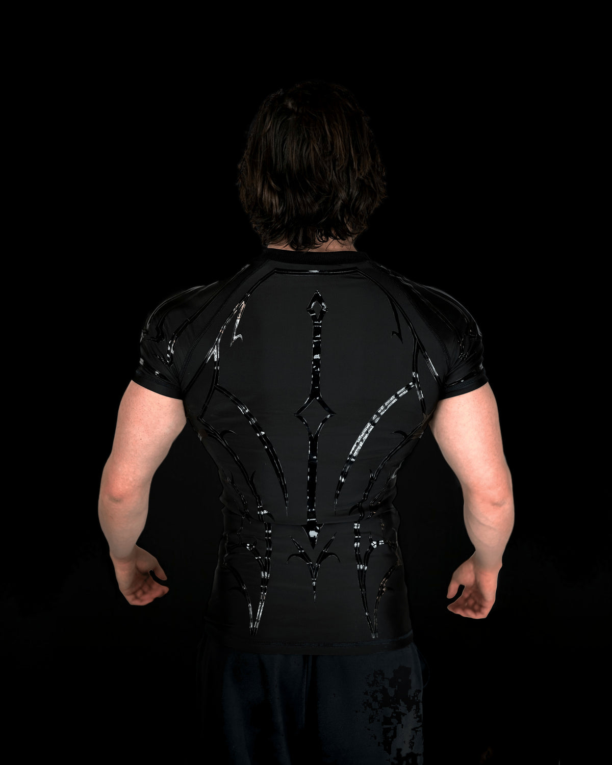 Knight Compression Midnight, back view with the silicone armor pattern